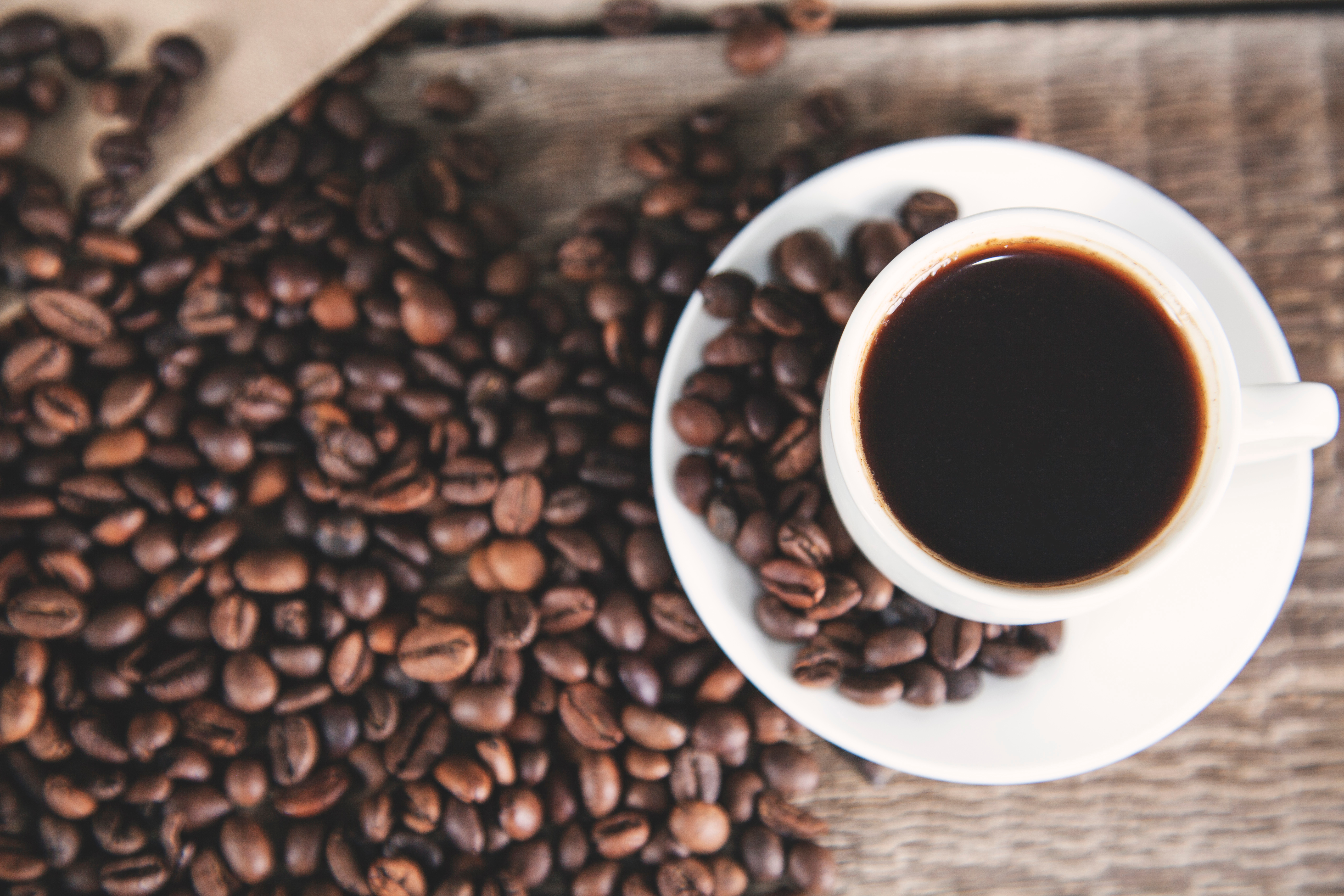 Coffee cup with coffee beans