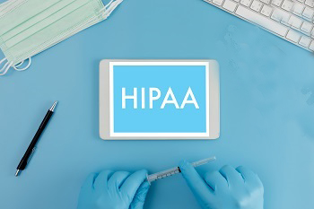 HIPAA with hands holding pencil